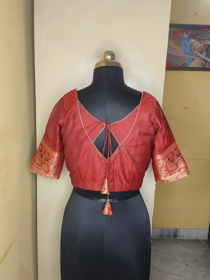 Deep red silk, Kalamkari-style gold sleeve border