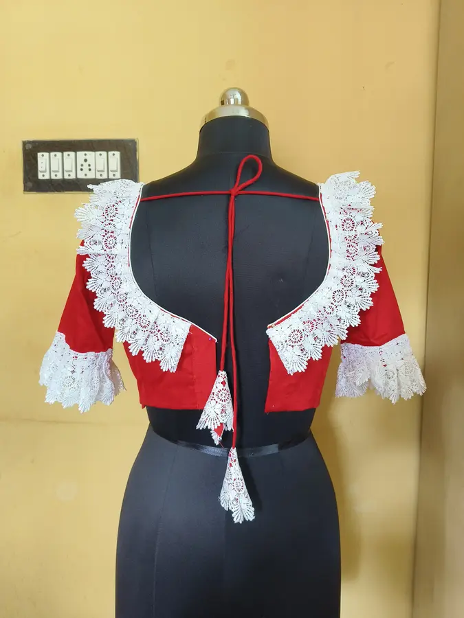 Red cotton silk, white lace trim at shoulders and sleeves