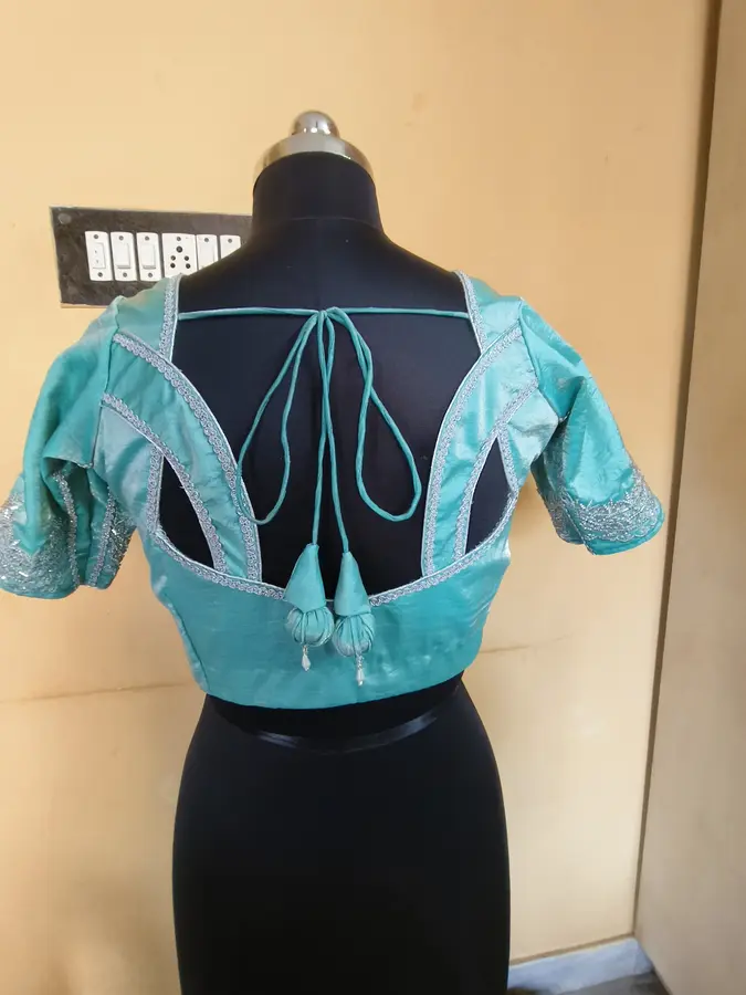 Turquoise silk, silver trim, geometric back straps
